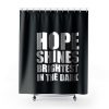 Hope shines brightest in the dark Shower Curtains